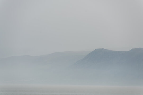 Cliff In Mist, Isle Of Anglesey, Wales, UK