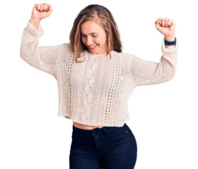 Young beautiful blonde woman wearing casual sweater dancing happy and cheerful, smiling moving casual and confident listening to music