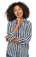 Young african american girl wearing casual clothes looking confident at the camera with smile with...