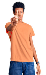 Young african american man wearing casual clothes pointing with finger up and angry expression, showing no gesture