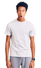 Fototapeta premium Young african american man wearing casual clothes afraid and shocked with surprise expression, fear and excited face.