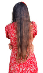 Brunette teenager girl wearing summer dress standing backwards looking away with crossed arms