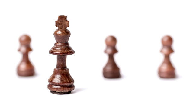 Challenging wood king chess game for victory. Isolated on white background.