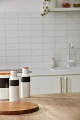 Kitchen interior background with wooden cutting board and spice jars. copy space