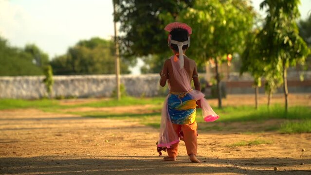 Lord Krishna running in the ground on Happy Janmashtami holiday Indian festival greeting background