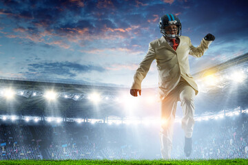 Businessman acting as american football players