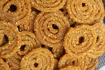Indian Traditional Tea Time Snack Chakli, a deep fried snack, It is known as Chakali, Murukku, Muruku, Murkoo, Chakri. Chakali closeup 