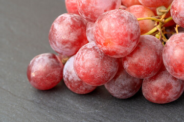 Harvest of ripe, juicy, red grapes with large berries close-up