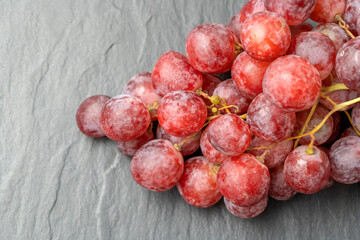 Harvest of ripe, juicy, red grapes with large berries close-up