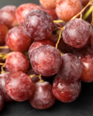 Harvest of ripe, juicy, red grapes with large berries close-up