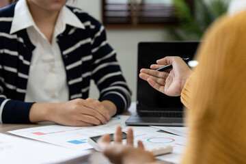 Group of business asian people analysis financial graph on desk at meeting room