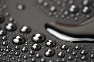 Water drops on a black background close-up