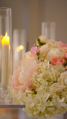 pink and white bouquet of flowers and candles