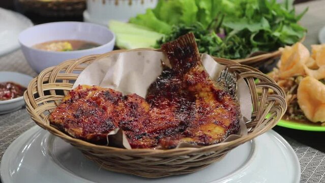 gourami roasted fish served in a gourmet restaurant tasty and healthy traditional asiatic food