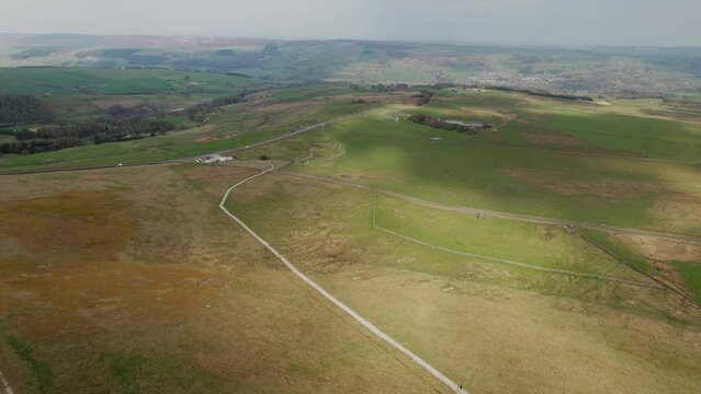Aerial drone backward moving shot of Coldstones Cut landmark next to Hanson Aggregates Quarry in Harrogate, North Yorkshire, UK on a suuny day.
