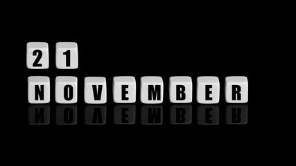 November 21th. Day 21 of month, Calendar date. White cubes with text on black background with reflection. Autumn month, day of year concept