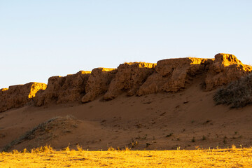 Remains of rammed earth Great Wall. At sunrise.