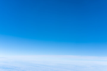Bright blue sky gradient background. Clear empty sky texture, blank skyscape poster with no clouds. Cloudless empty sky. Natural background of the blue sky