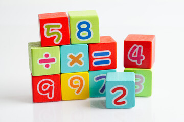 Number wood block cubes for learning Mathematic, education math concept.