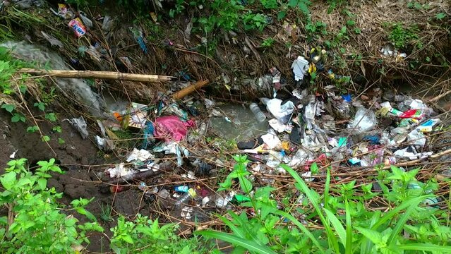 Footage of plastic waste blocking waterways