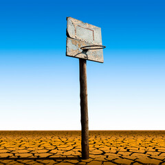 An old basketball hoop in a dry desert as an abstraction.
