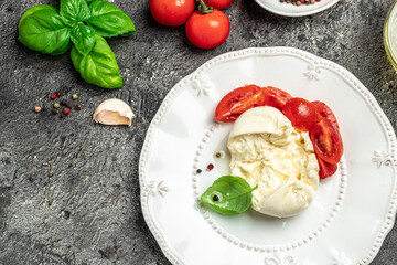 fresh soft white burrata cheese ball made from mozzarella and cream from Apulia, Italian...