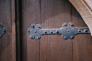 Iron old rivets of a wooden church or historical town hall door. Quest game and mystical background