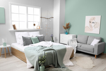 Stylish interior of modern bedroom with sofa © Pixel-Shot