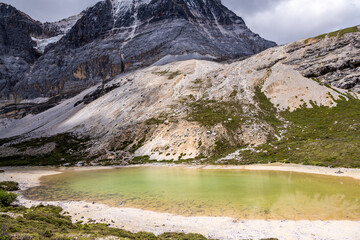 Natural scenery of Yading snow mountain and beautiful emerald glacier lake in Daocheng