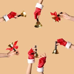 Many female hands with Christmas bells on beige background