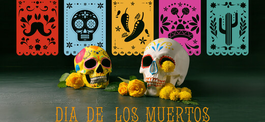 Painted human skulls and flowers on dark color background. Mexico's Day of the Dead (El Dia de...