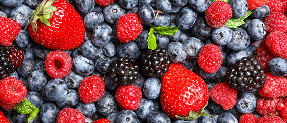 Different fresh berries as background, top view