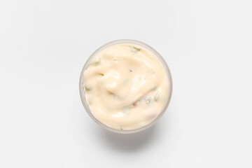 Fototapeta na wymiar Glass bowl with tasty Caesar sauce on white background