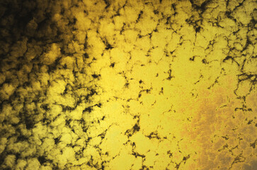 Abstract gold grunge-patterned Japanese washi paper. Black Japanese paper texture background with gold pattern.