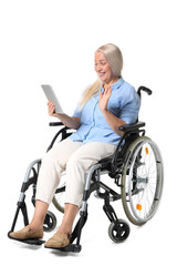 Mature woman in wheelchair and with tablet isolated on white