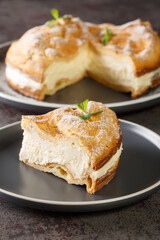 Carpathian cake Traditional Polish choux pastry cake Karpatka closeup on the plate on the table. Vertical