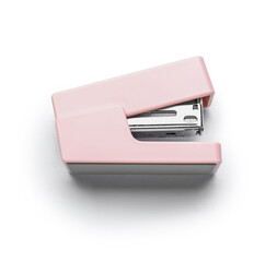 Pink stapler isolated on white background