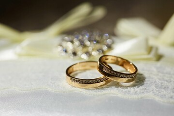 Wedding rings in a beautiful design. The concept of a wedding or engagement