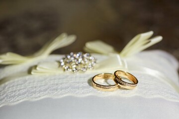 Wedding rings in a beautiful design. The concept of a wedding or engagement