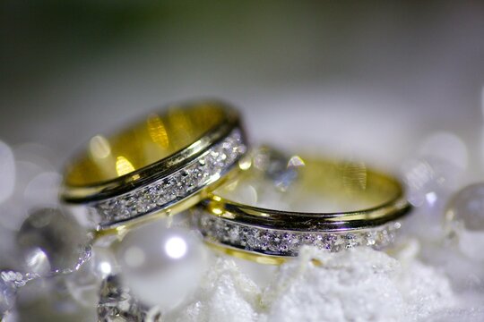 Wedding rings in a beautiful design. The concept of a wedding or engagement