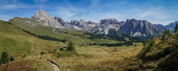 Fototapeta na wymiar Amazing panoramic view in the dolomites: from seceda alp to sella group and sassolungo group and to world famous alp de siusi. south tyrol, italy, garda valley. puez odles nature park.