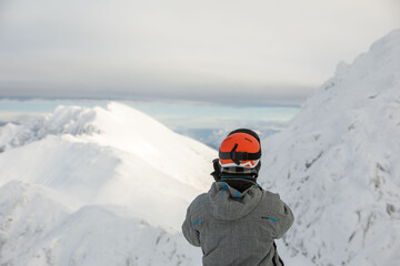 Fototapeta na wymiar man skier enjoying landscape view of winter mountains