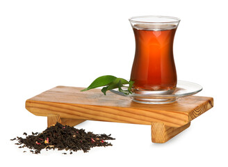 Wooden board with glass cup of black tea on white background