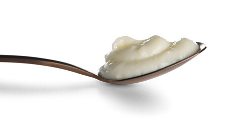 Spoon of tasty vanilla pudding on white background, closeup