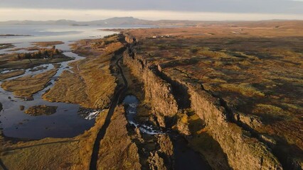 Drone fliyng over tectonic plate in Thingvellir National Park, Iceland. Aerial forward