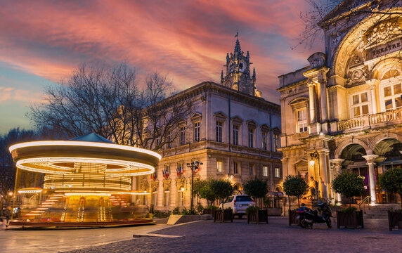 One evening Place de l'Horloge and its merry-go-round, in Avignon, Provence, France