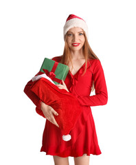 Beautiful young woman in Santa hat with bag of gifts on white background