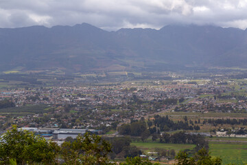 View down to the town of Paarl on a cloudy day taken from Paarl Rock