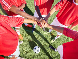 Soccer, team and hand in stack on field for motivation, support and teamwork at game, contest or match. Football, group and soccer player on pitch together with hands for goal, success and sports - Powered by Adobe