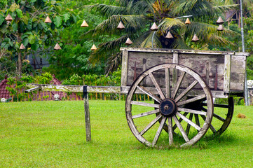Fototapeta na wymiar An old wooden carriage in the park, in Gunung Kidul, Yogyakarta, Indonesia